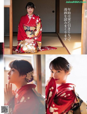 A woman in a red kimono standing in front of a tree.