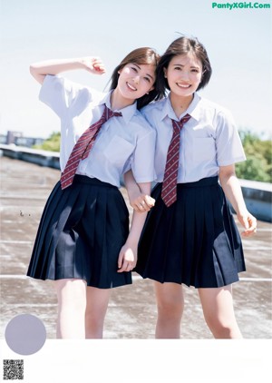 A woman in a school uniform is posing for a picture.